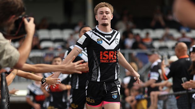 Lachlan Galvin of the Magpies runs out at the start of the NSW Cup game.