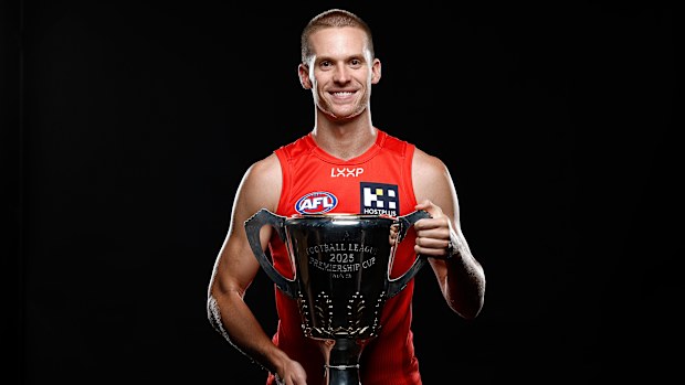 Noah Anderson of the Suns poses with the Premiership Cup