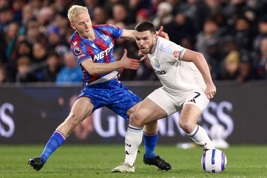 Aston Villa's John McGinn and Crystal Palace's Will Hughes during the Premier League match on 25 February, 2025