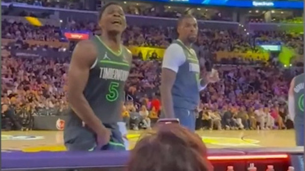Timberwolves' Anthony Edwards gestures towards the crowd.