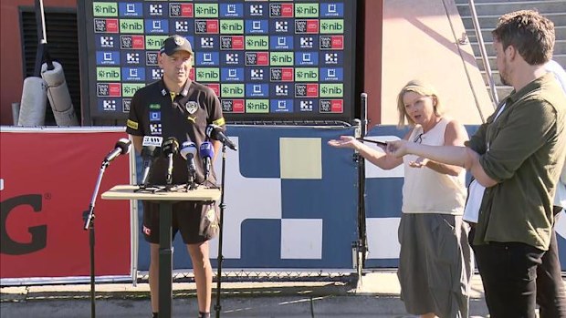 Richmond coach Adem Yze and the club's media manager.