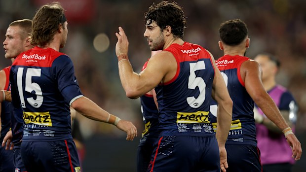 MELBOURNE, AUSTRALIA - APRIL 24: Christian Petracca of the Demons is congratulated by team mates after kicking a goal during the round seven AFL match between Melbourne Demons and Richmond Tigers at Melbourne Cricket Ground, on April 24, 2025, in Melbourne, Australia. (Photo by Robert Cianflone/Getty Images)