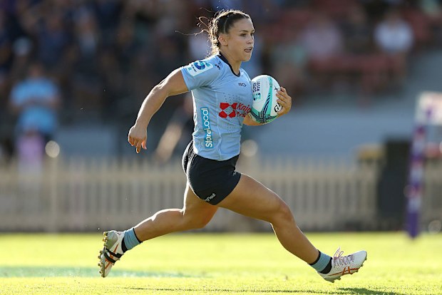 Desiree Miller of the Waratahs breaks through to score a try
