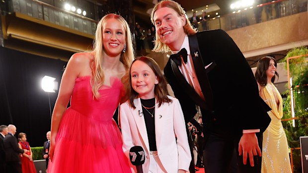 Harley Reid of the Eagles and partner Yasmin Duursma pose for a photo 