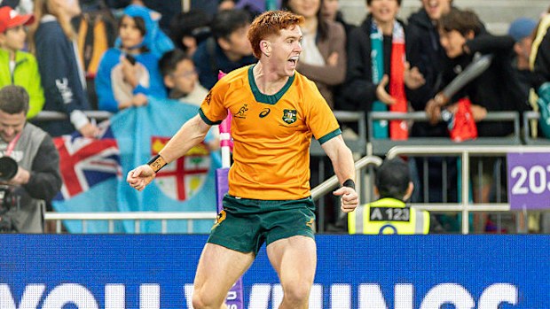 Sidney Harvey of Australia celebrates his try.