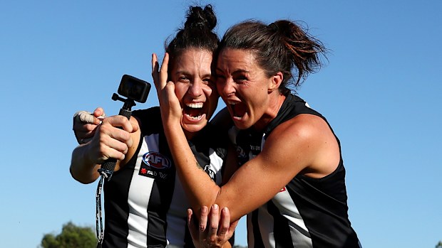 Collingwood Magpies teammates Ash Brazill and Sharni Norder celebrate an AFLW finals series victory in 2021.