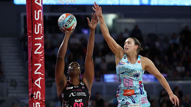 Romelda Aiken-George of the Thunderbirds shoots under pressure from Olivia Lewis of the Mavericks.