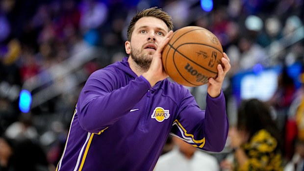Luka Doncic #77 of the Los Angeles Lakers shoots the ball while warming up before the game against the Detroit Pistons at Little Caesars Arena on March 23, 2026 in Detroit, Michigan.