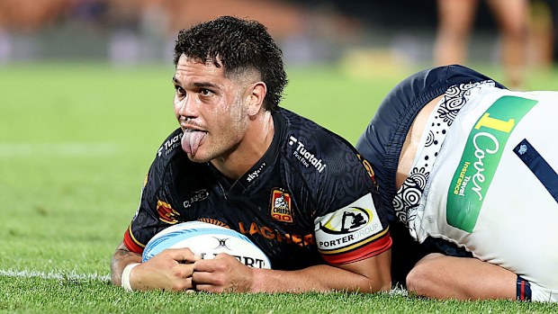 Quinn Tupaea of the Chiefs celebrates after scoring a try.