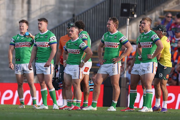 Raiders players reacting to a Knights try.