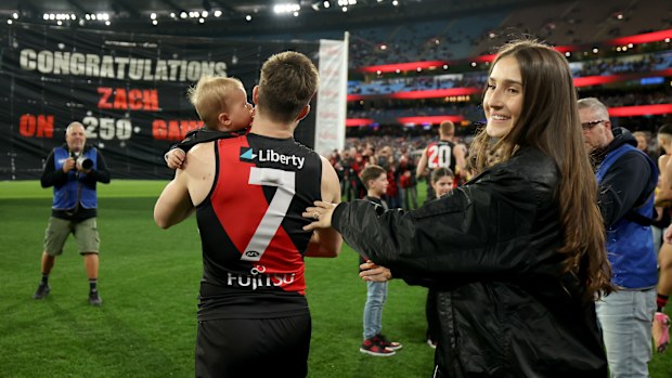 Zach Merrett of the Bombers is celebrated by his wife Alexandra and son Jude during his 250th game.