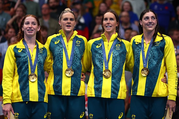 From left: Mollie O'Callaghan, Shayna Jack, Emma McKeon and Meg Harris pictured during the medal ceremony after winning 4x100m freestyle gold at the Paris Olympics.