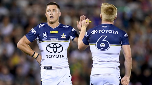 Scott Drinkwater and Tom Dearden of the North Queensland Cowboys in action.