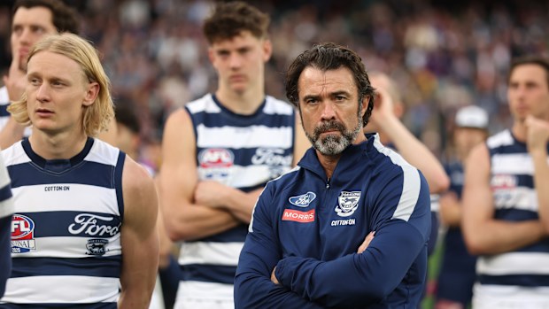 Geelong coach Chris Scott watches on after the Cats were defeated by the Lions in the AFL grand final.
