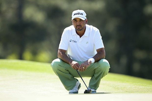 Jason Day lines up a putt during the first round of the 2026 Masters.