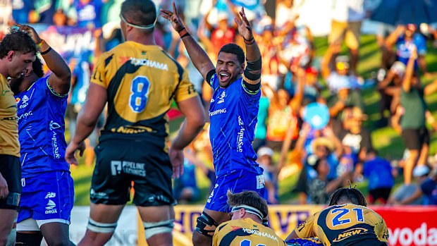 Drua players celebrate a try.