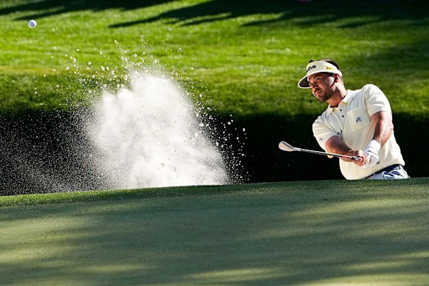 Jason Day, of Australia, hits from the bunker on the 16th hole during the second round of the Masters golf tournament at the Augusta National Golf Club, Friday, April 10, 2026, in Augusta, Ga. (AP Photo/Gerald Herbert)