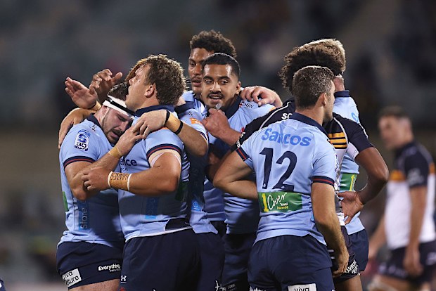 Ethan Dobbins of the Waratahs celebrates a turnover with teammates.