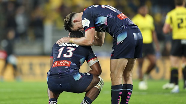 Filipo Daugunu and Lachie Anderson of the Rebels react after the final whistle.