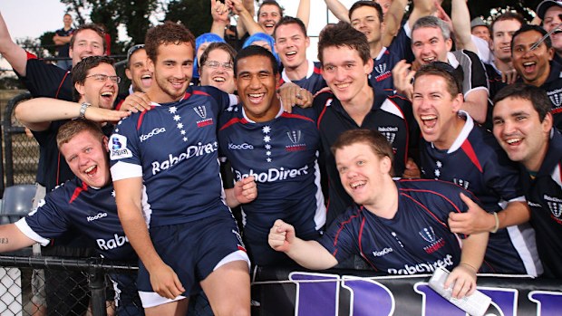 Danny Cipriani and Cooper Vuna of the Rebels celebrate with their supporters.