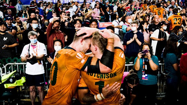 Australia celebrate with the trophy after defeating Fiji in 2022 in Hong Kong.