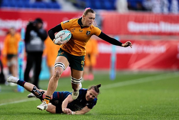 Maddison Levi of Australia breaks a tackle.