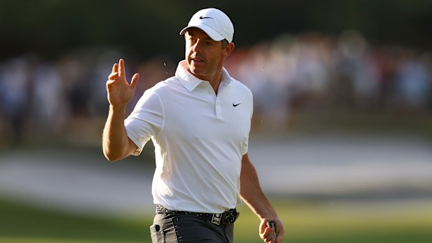 Rory McIlroy of Northern Ireland acknowledges the roaring gallery after sinking a birdie putt on the 10th hole during the opening day of the Crown Australian Open 2025 at Royal Melbourne.