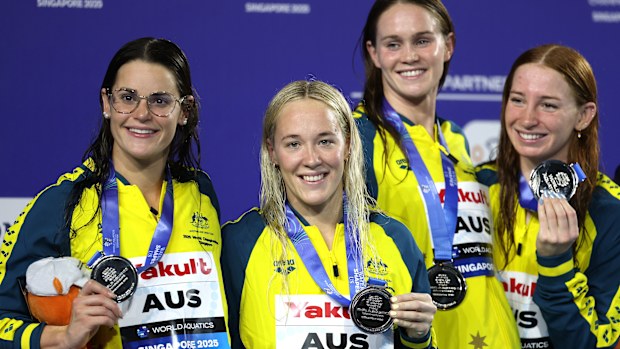 SINGAPORE, SINGAPORE - AUGUST 03: Silver medalists Kaylee McKeown, Ella Ramsay, Alexandria Perkins and Mollie O'Callaghan of Team Australia pose on the podium during the Womens 4x100m Medley Relay medal ceremony on day 24 of the Singapore 2025 World Aquatics Championships at World Aquatics Championships Arena on August 03, 2025 in Singapore. (Photo by Adam Pretty/Getty Images)