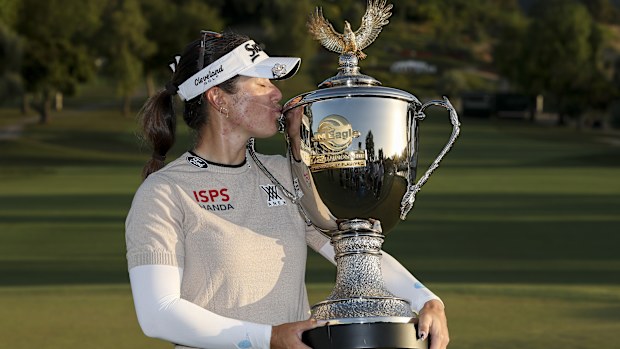 Hannah Green celebrating with the trophy.