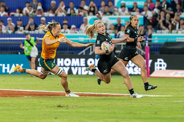 Jorja Miller runs with the ball during the women's cup final for New Zealand.