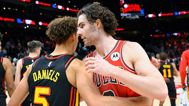 Dyson Daniels (L) and Josh Giddey (R) embrace after the game.