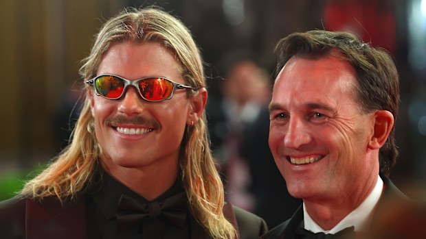 Bailey Smith of the Cats and Andrew Dillon, Chief Executive Officer of the AFL are seen during the 2025 Brownlow Medal