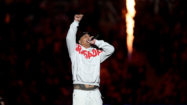 Scribe performs during the round 11 Super Rugby match.