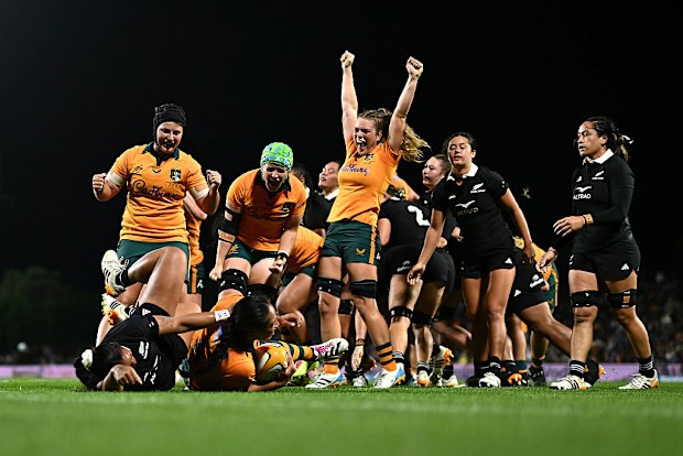 Wallaroos celebrate Siokapesi Palu's try.