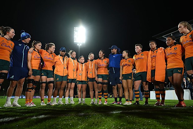 The Wallaroos huddle after their defeat.