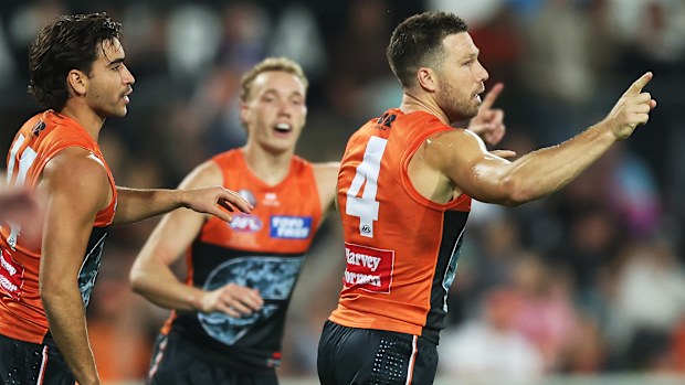 Toby Greene of the Giants celebrates kicking a goal.