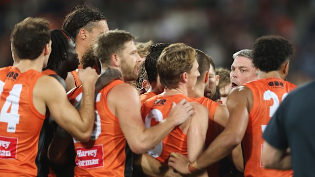 Senior coach Adam Kingsley talks to players during the round seven AFL match.