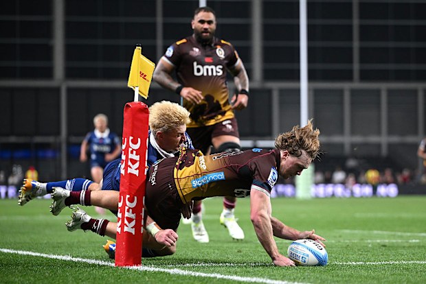 Tim Ryan of the Reds scores a try during the round 11 Super Rugby match.