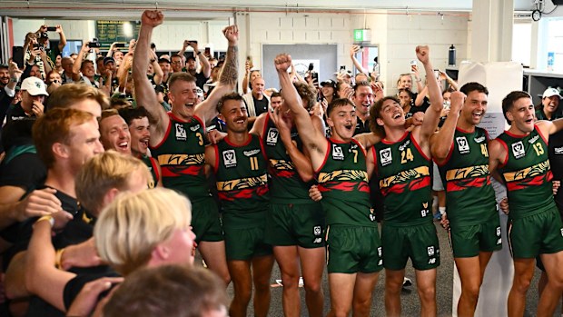The Tassie Devils celebrate their inaugural VFL victory.