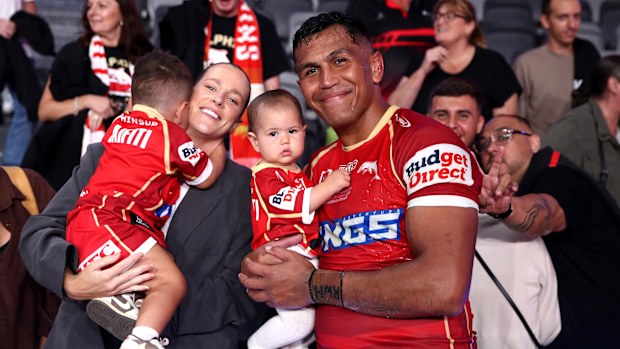 Daniel Saifiti of the Dolphins poses for a photo with his family.