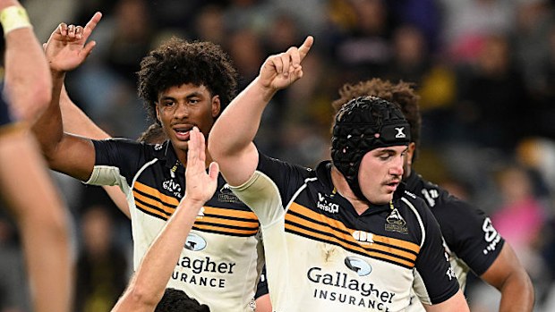 Brumbies players rejoice following Luke Reimer's try.
