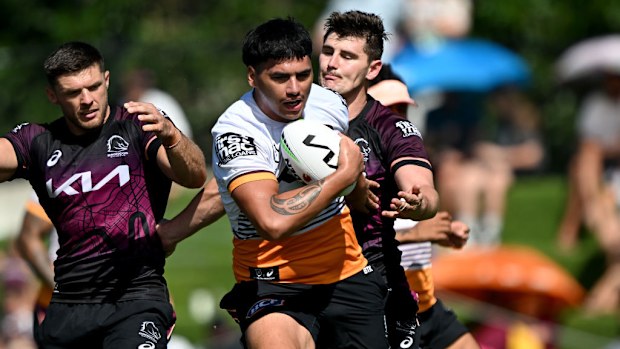 Benjamin Te Kura takes on the defence during a Brisbane Broncos NRL training session.