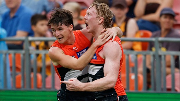 Phoenix Gothard (left) and Clayton Oliver of the Giants celebrate.