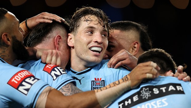 Cameron Murray revels with teammates after a Bradman Best try during the 2023 State of Origin series.