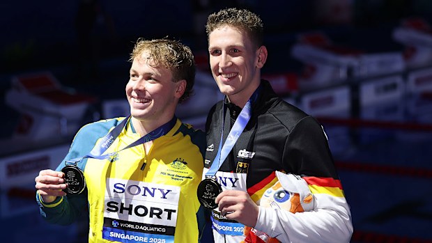 Silver medallist Samuel Short and gold medallist Lukas Martens pose with their world championship medals.