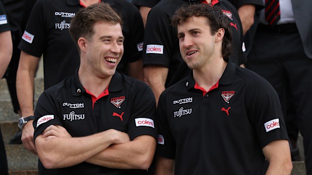 Zach Merrett and Andrew McGrath of the Bombers.