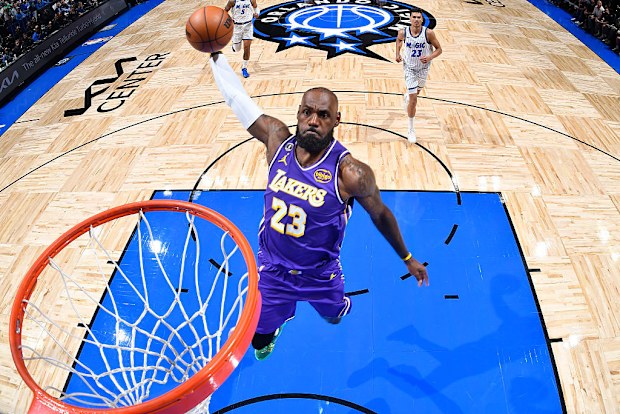LeBron James dunks the ball.