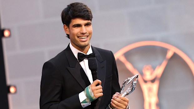 Carlos Alcaraz receives the Laureus World Sportsman of the Year award while sporting a cast on his wrist.