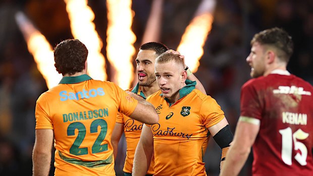 Max Jorgensen of the Wallabies celebrates after scoring a try.