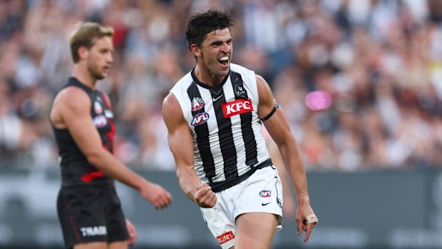 Scott Pendlebury of the Magpies celebrates kicking a goal.